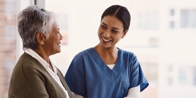 Health care worker helping patient
