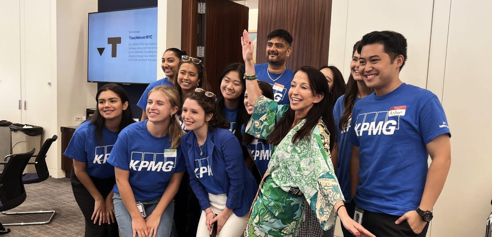 KPMG employees smiling at a Cause Day event