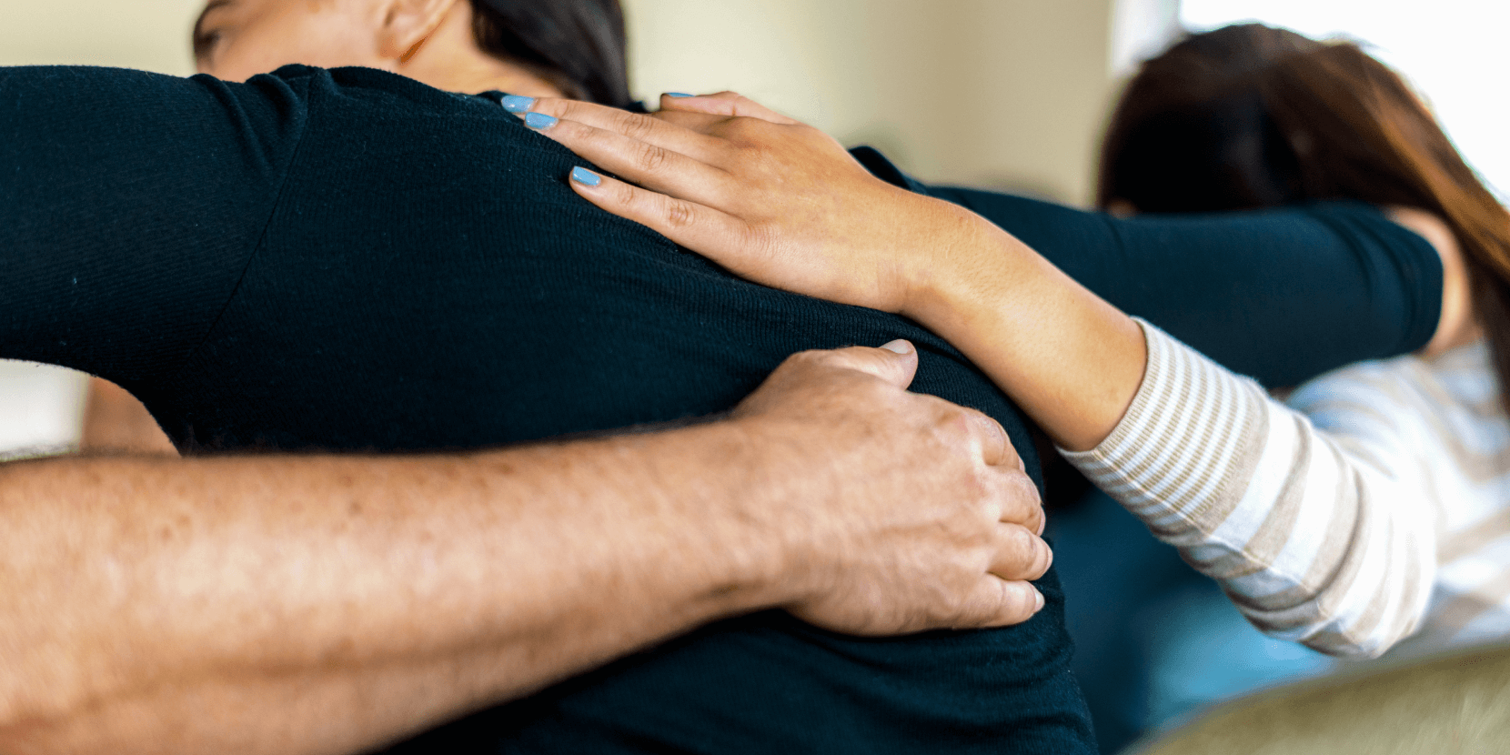 Back of community members shoulder to shoulder