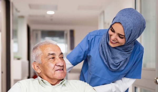 Case study cover image of a nurse pushing an elderly male patient in a wheel chair