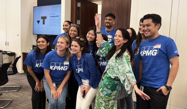 Case study cover image of a group of KPMG Employees posing and smiling